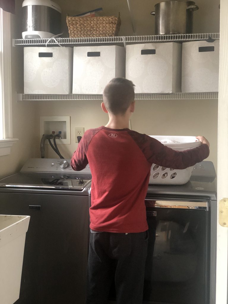 Life skills: boy doing laundry
