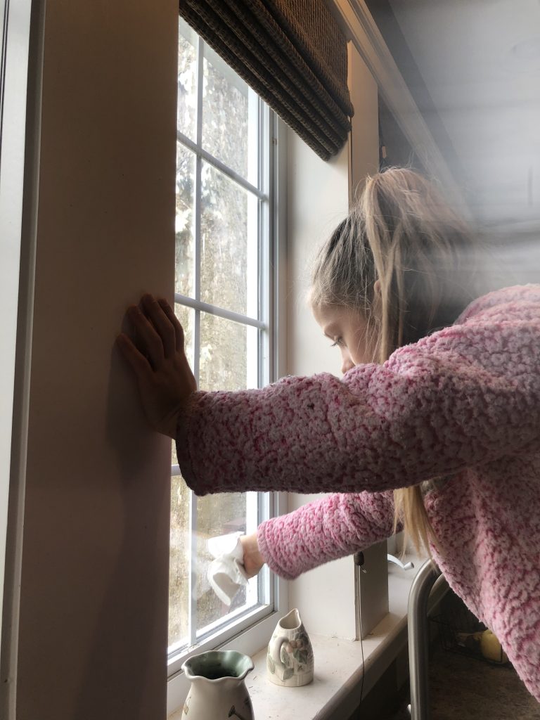 girl washing windows