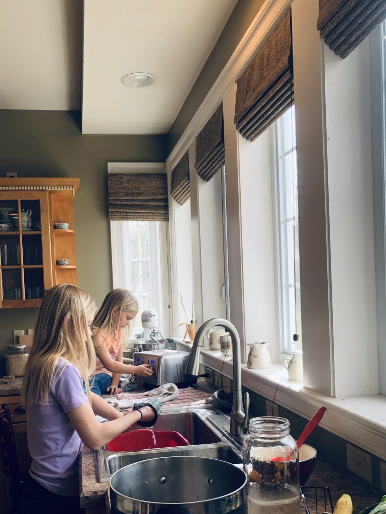 two girls doing the dishes