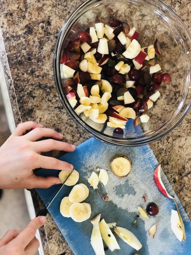 someone making a fruit salad