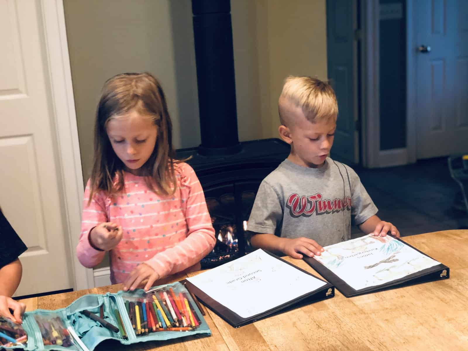 boy and girl with portfolios
