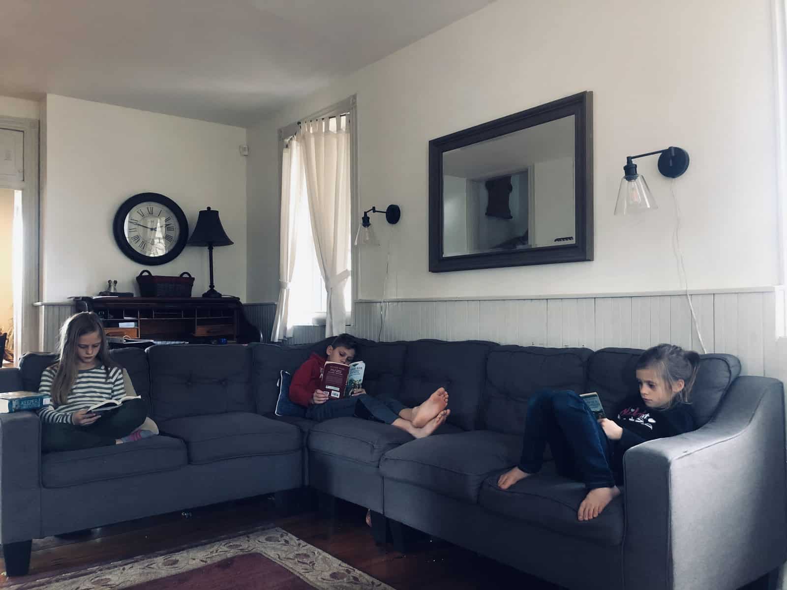 kids reading on a couch